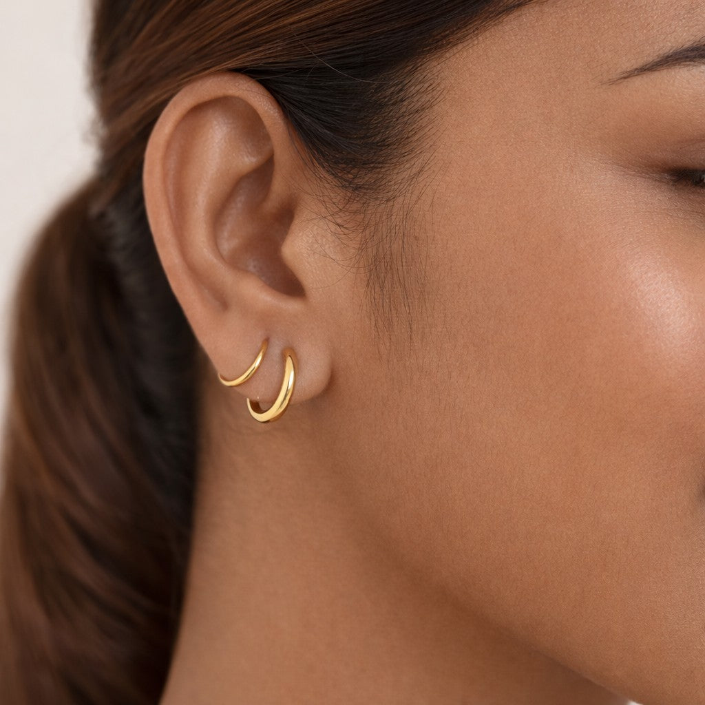 Double layer cord hoop earrings in gold tone stainless steel