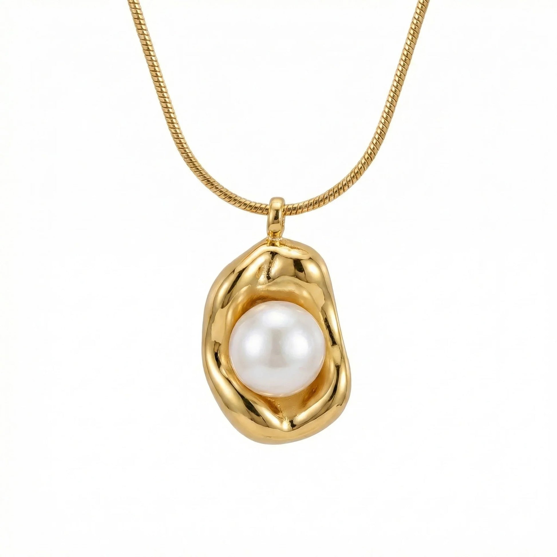 Gold stainless steel necklace with abstract pendant and white pearl center on white background