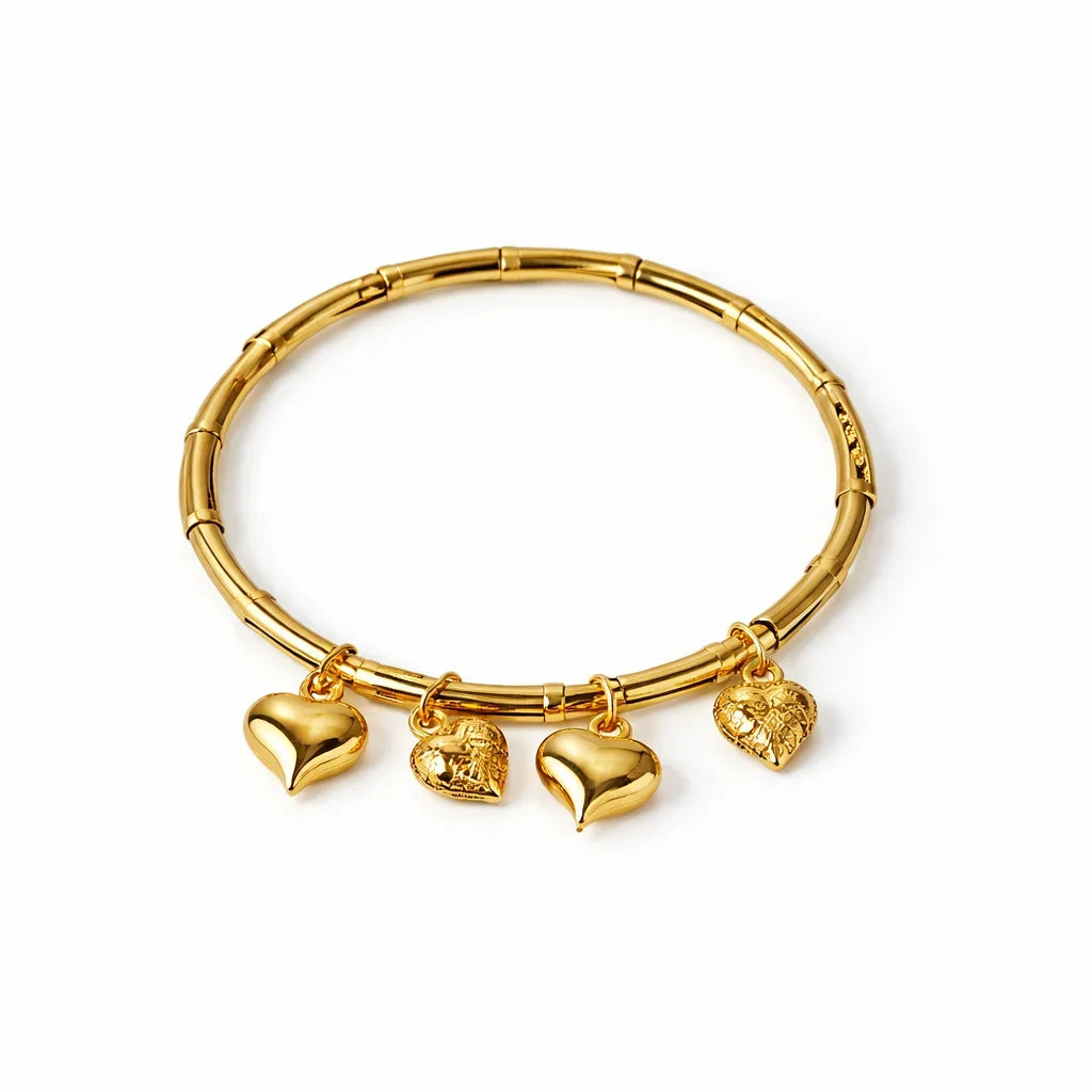 Gold-tone bangle bracelet with four heart charms, stainless steel, minimalist jewelry
