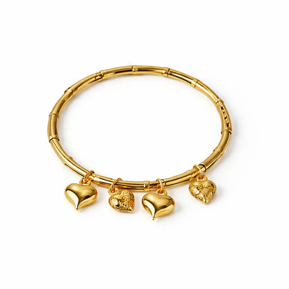 Gold-tone bangle bracelet with four heart charms, stainless steel, minimalist jewelry